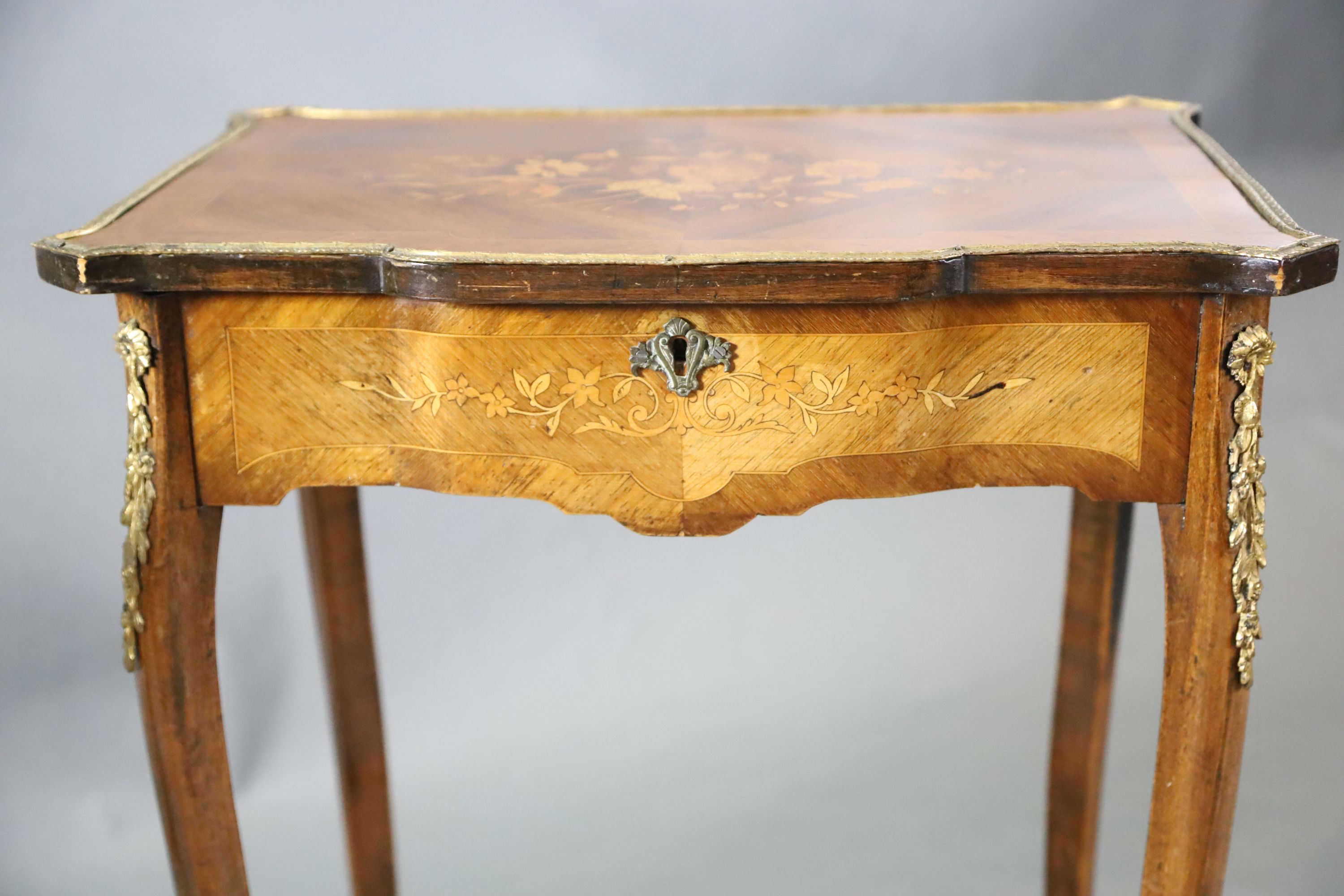 A pair of Louis XVI style ormolu mounted marquetry work tables, W.1ft 9in. D.1ft 3in. H.2ft 6in.